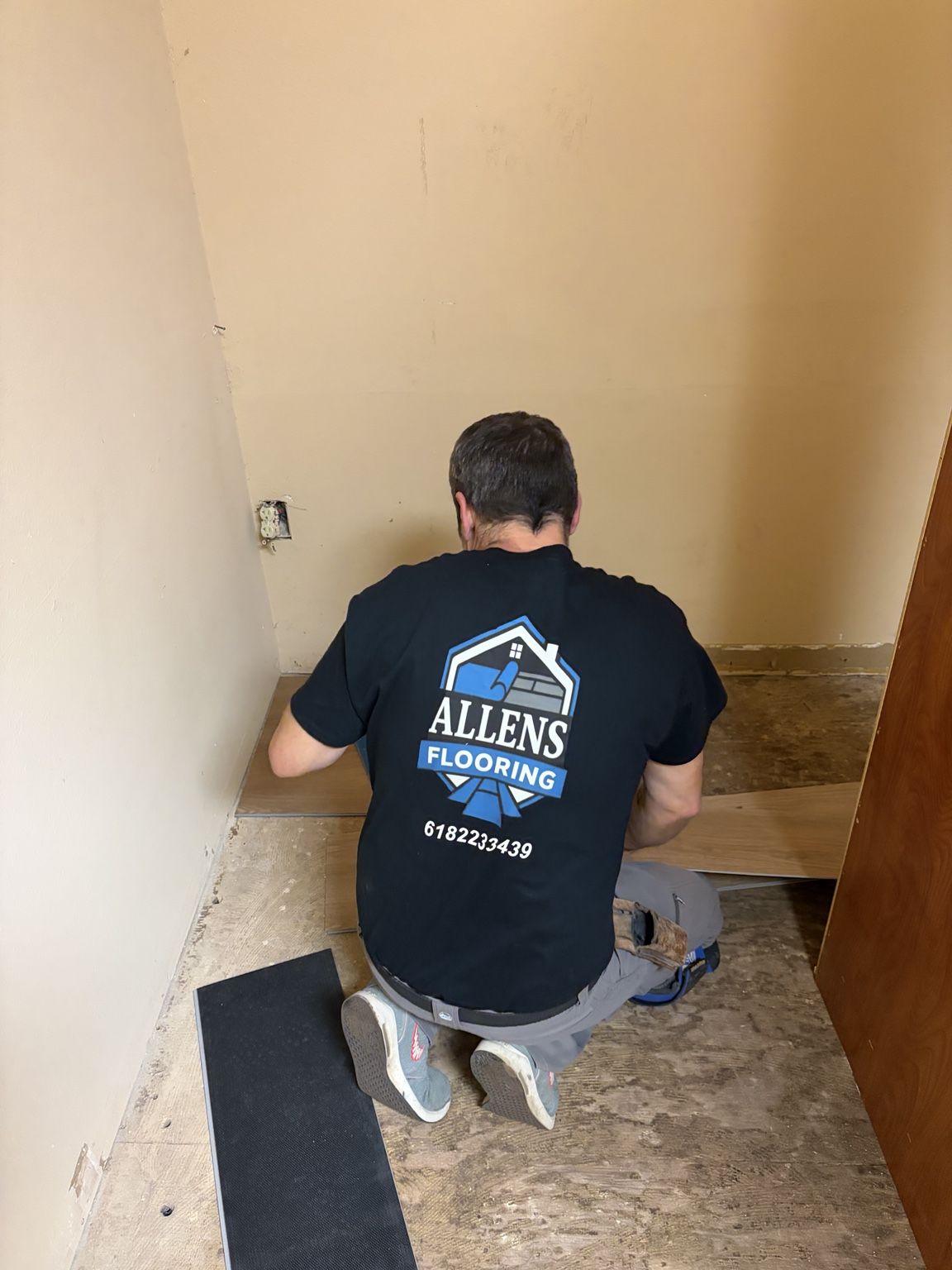 Allen's Flooring installer working