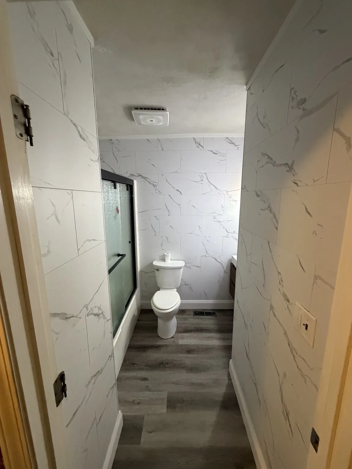 Full bathroom wall and flooring renovation
